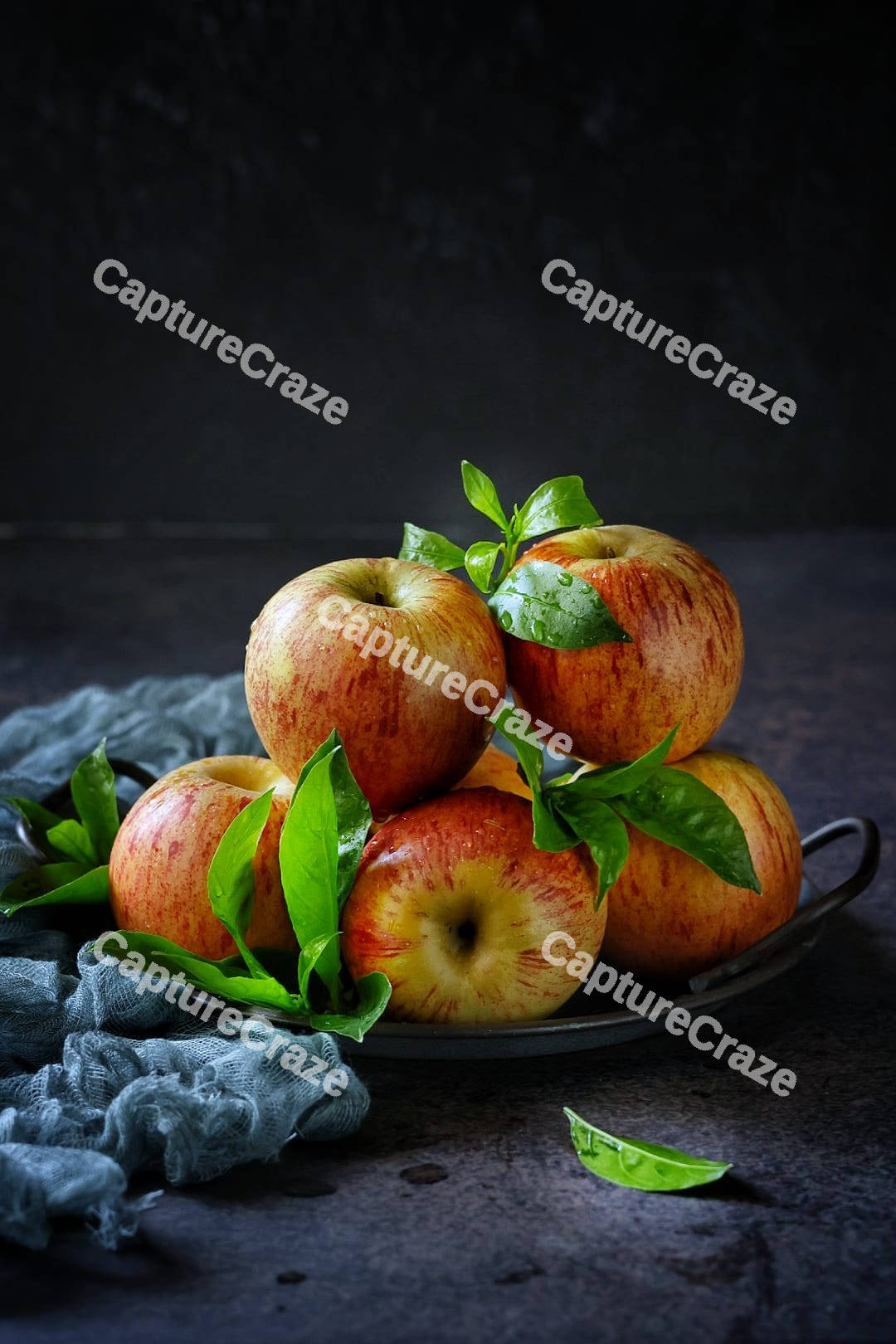 Red apples on a plate
